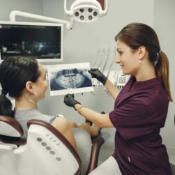 The dentist treats the girl's teeth. A young woman visited a dentist